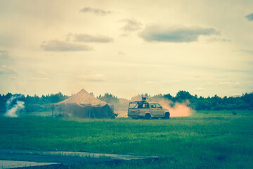 Military tent in the smoke.