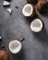 Obraz na płótnie Canvas coconuts on a gray background dark photo