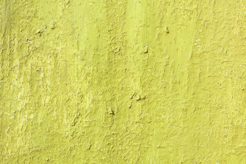Beautiful vintage yellow background with old yellow paint with rough surface, streaks and uneven texture of yellow paint on old rough surface
