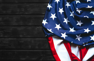 American Flag on black  wooden   background with top view and copy space.