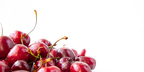 Bunch of ripe cherries closeup isolated on a white background. Beautiful natural background.