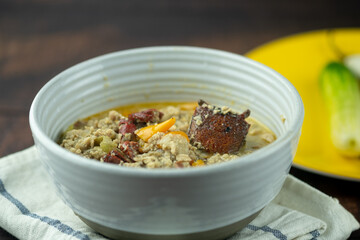 Soy bean paste with mince crab or pork with coconut milk in bowl.