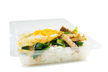 Stir-fried kale vegetable with crispy pork in plastic box,thai lunch box,thai food packed lunch.