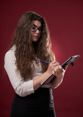 Young businesswoman with a clipboard