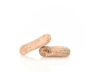Organic, natural cocoa beans, close-up, on a white background.