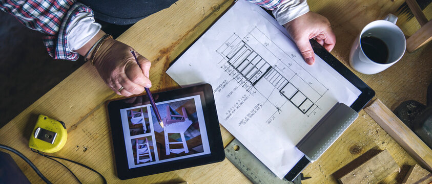 Top view of unrecognizable senior female carpenter working in a carpentry workshop