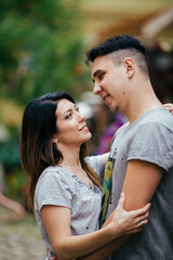 Fototapeta premium A couple in love slowly walks the streets of the city on a cool autumn morning.