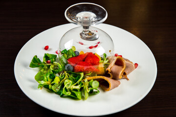 salad with meat and berries