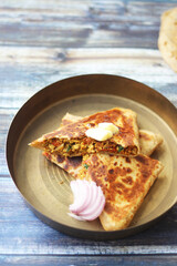Egg paratha or egg Bhurji roti. A very Indian quick meal preparation for breakfast or snack time.  Made with egg and other Indian spices.