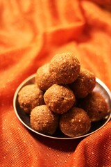 Ladoo, Traditional Indian sweets made for Diwali and another festive season. made with ingredients like peanuts, semolina, sesame seeds, ghee, clarified butter, jaggery, sugar, and cardamom 