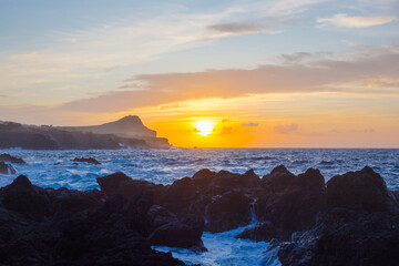Fototapeta na wymiar Lava stones on the beach of Piscinas Naturais Biscoitos. Atlantic Ocean. Terceira Azores, Portugal.