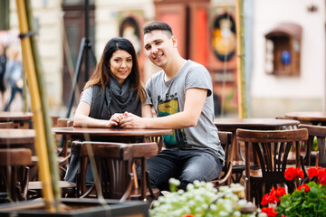 young couple posing on city background, travel concept