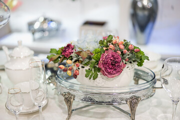 white table setting with flowers