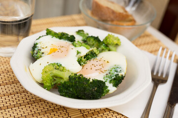 breakfast of crumpled eggs with broccoli