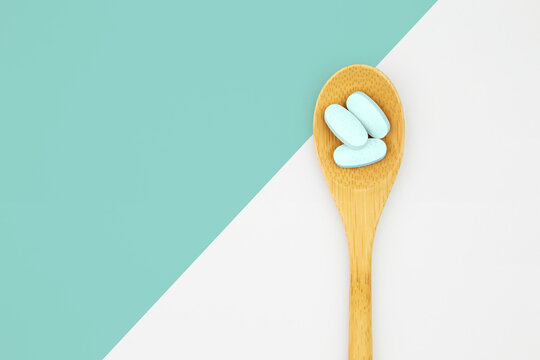 Wooden tablespoon with healthy supplements