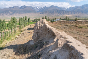 The view of old ancient ruined city Koshoy Korgon and the clay city wall in Kyrgyzstan