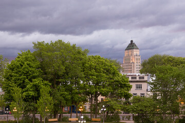 View of d’Auteuil Street houses and other buildings seen from the top of Old Quebec walls during an early spring morning with a stormy sky in the background, Quebec City, Canada
