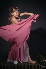 A little girl dressed as an belly dancer