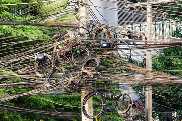 Utility pole with lots of entangled electrical wires, Chiang Mai, Thailand