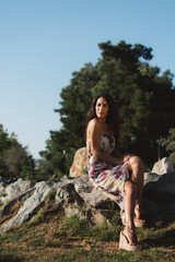 Girl in a dress posing in motion on a street background