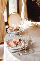 Festive table setting with empty wine glasses