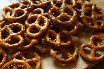 Pretzels Small Salted Mini Twists on a Wooden Board Close Up