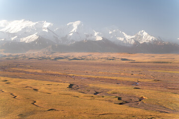 The amazing wild view of kyrgyzstan landscape full of snow peaks and wilderness