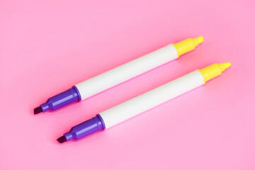 yellow and purple stationery marker for writing and highlighting text