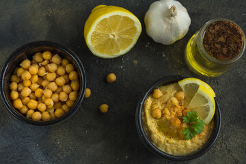 Hummus is a traditional appetizer made from chickpea puree the products it is made from are chickpeas, lemon, garlic and olive oil, horizontal arrangement