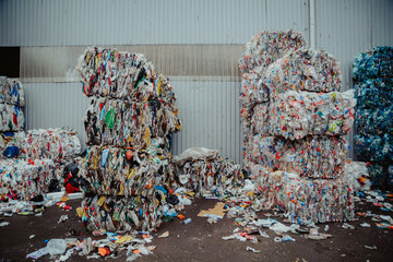large stacks with compactly packed plastic waste ready for transport