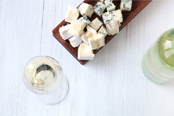 Bottle of white wine and cheese