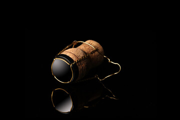 champagne cork isolated on black background with copy space for your text