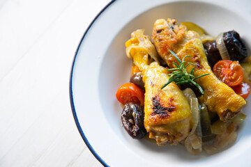 Chicken with plumbs and zucchini