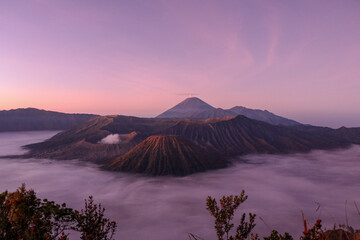Sun rises upon volcanoes, Java, Indonesia.