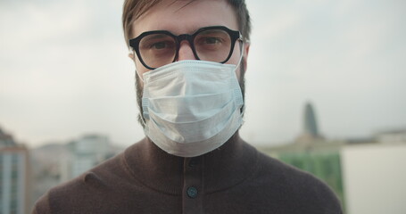 Portrait young pandemic doctor wearing medical mask coronavirus protection on street.Concept of healthcare and safety life,COVID19 coronavirus,healing virus,stop pandemia in World
