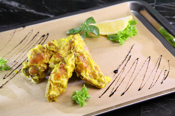 Chicken wings in spicy sweet sauce.