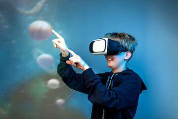 space exploration Various graphs and connectivity points against boy using a virtual reality device