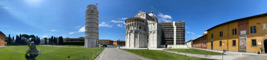 Fototapeta na wymiar Field of Miracles and Leaning Tower, Pisa. Panoramic view without tourists on a sunny day