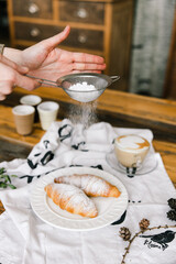 croissants on a plate sprinkle with powder