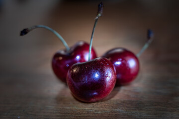 Set of fresh cherries close up on wooden table
