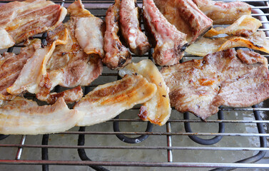 ribs of pork on the hot grill
