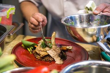 serving dishes on a plate in a professional kitchen close up
