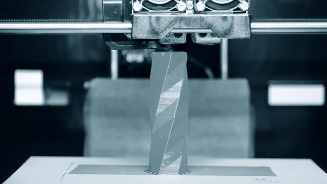 5 in 1.Modern additive technologies.3d printer printing molten plastic