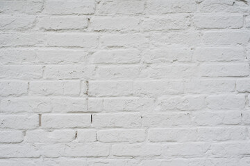 texture of an old brick wall painted with white paint