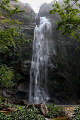 Fototapeta na wymiar Wli Waterfalls in the middle of the mountains in Ghana.