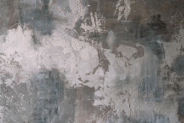 The texture of the old gray concrete wall for the background in the loft style with scuffs and...