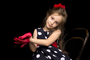 Naklejka premium Portrait of Coquettish Girl Posing on Isolated Black Background