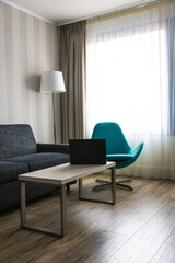 Modern house with a black laptop on the table