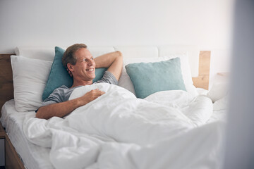 Relaxed mature man enjoying his lazy morning