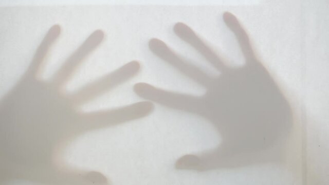 There are shadows of two arms.